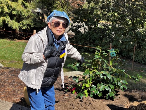 Hideko standing in front of the Camellia